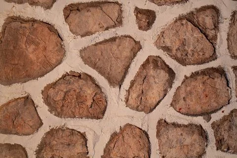 Old stone wall texture background. Rough stone wall. Big rough stones fence Stock Photos