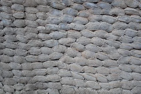 Old stone wall texture background. Rough stone wall. Big rough stones fence Stock Photos