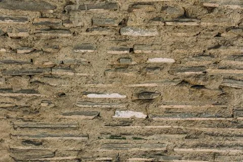 Old stone wall texture, cement, plaster. Background Stock Photos