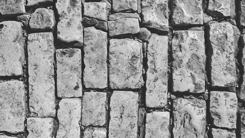 Old Stone Wall Texture. Grunge Backdrop or Wallpaper. Black and white Photo. Stock-Fotos