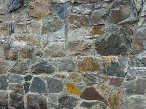 Old stone wall texture with visible crack, rustic masonry background, natur.. Stock Photos