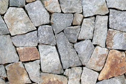 Old stone wall Texture in weathered and have natural surfaces. Foto stock