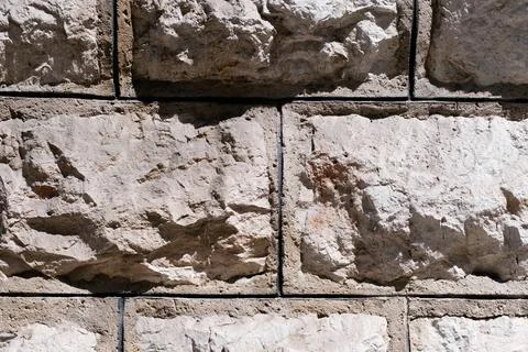 Old stone wall texture, weathered retro brick wall surface, textured masonry Stock Photos