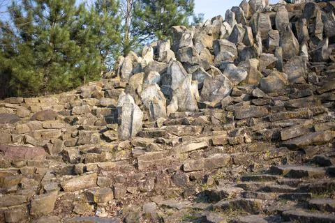 Old stone wall with trees as a background. Fotos Stock
