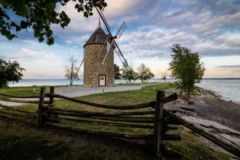 Old stone windmill with four blades. Stock Photos