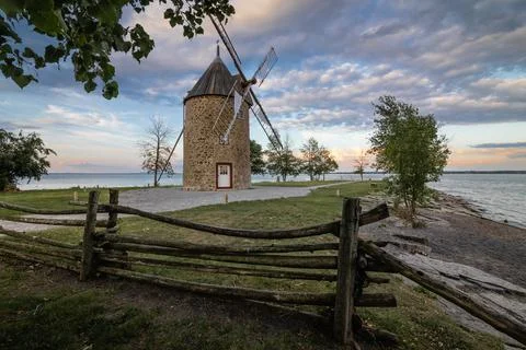 Old stone windmill with four blades. Stock Photos