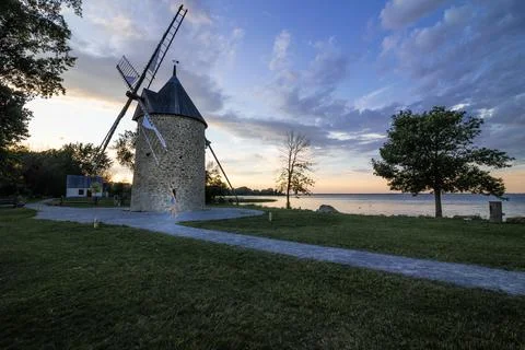 Old stone windmill with four blades. Stock Photos