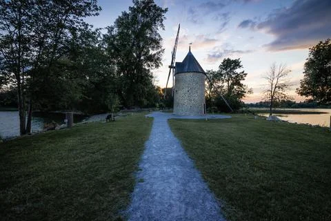 Old stone windmill with four blades. Stock Photos