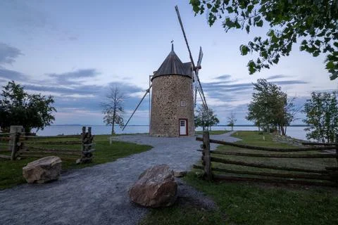 Old stone windmill with four blades. Stock Photos