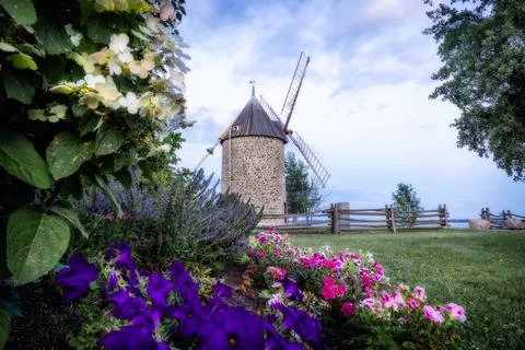 Old stone windmill with four blades. Stock Photos