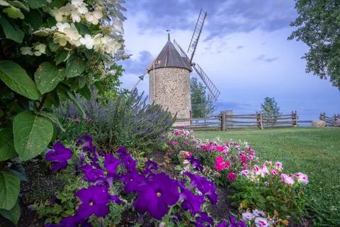 Old stone windmill with four blades. Stock Photos