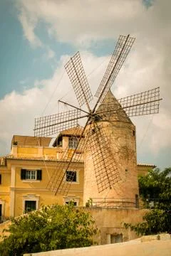 Old stone windmill on a summer day Stock Photos