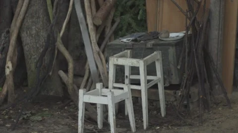 Old stools in the yard Stock Footage 68906748