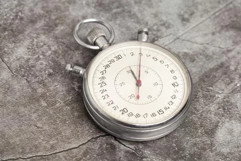 Old stopwatch on a gray background 스톡 사진