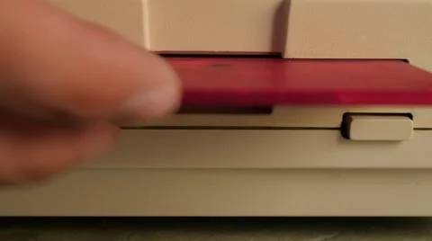Old storage device floppy disk inserting  in personal computer 4K 3840X2160 U Stock Footage 53395676