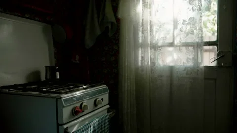 Old stove by the window in old dark kitchen, rural lifestyle ambience Stock Footage 236967900