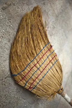 Old straw broom Stock Photos