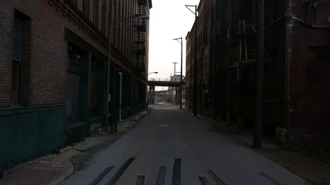 Old street between two abandoned buildings in industrial urban area Stock-Footage 104872197