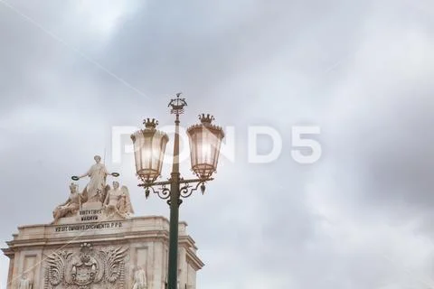 Old street lamp in Lisbon, detail of an old lighting in the city. Stock Photos
