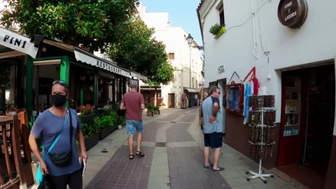 Old street in Tossa de Mar. Souvenir shops in Spain Stock Footage 172064336