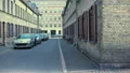 Old streets of Copehagen with cars and bicycles, ancient architecture, history HD Footage