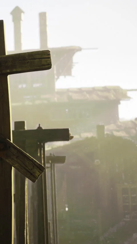 Old structures stand in faded light behind wooden posts at a forgotten site Stock Footage 331369299