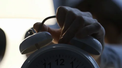 Old style alarm clock ringing early in the morning Stock Footage 102311694