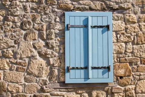 Old style blue window at wall Stock Photos