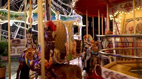 Old style carousel moving on square in city. Stock Footage 232183959