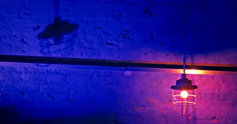 Old style Ceiling lamp hangs on long chain and sways in different directions Stock Footage 220881678