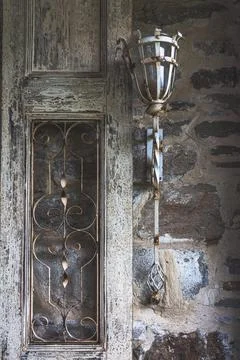 Old style lantern on a corroded wall Stock Photos