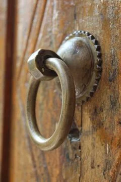 Old style round head knocker vintage door handle Stock Photos