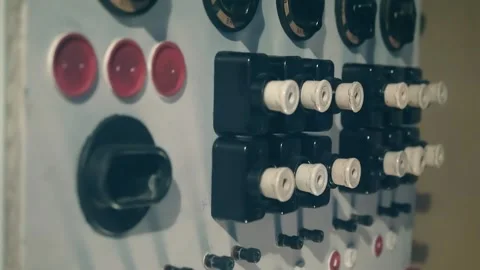 Old style rows of electrical switches and fuses in electrical distribution board Stock Footage 323907578