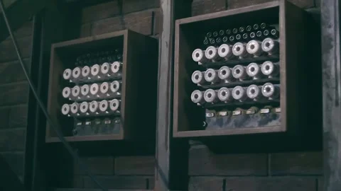 Old style rows of electrical switches and fuses in electrical distribution board Stock Footage 323963768