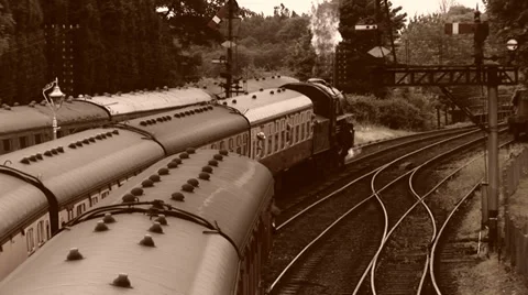 Old style shot of Steam train departing from station Stock Footage 39894714