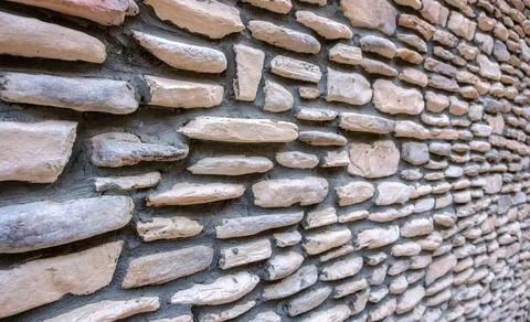 Old style stone wall Stock Photos