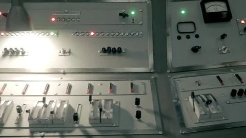 An old-style TV studio center console with microphones, knobs, buttons, gauges  Video stock 287946275