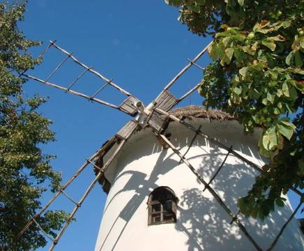Old styled ukrainian windmill Stock Photos