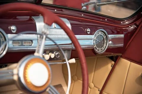 Old stylish clock on panel retro luxury car Stock Photos