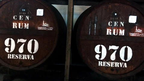 Old Sugarcane rum barrels (pan shot) produced by Engenhos do Norte Video stock 112072449