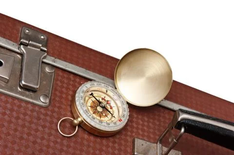 Old suitcase  and compass Stock-Fotos