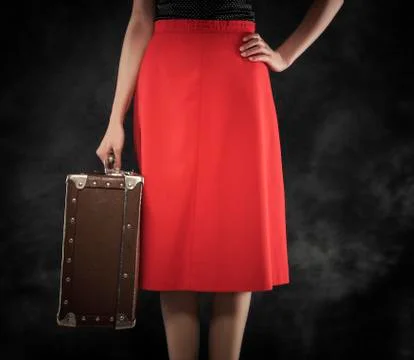 Old suitcase in hands. Stock Photos