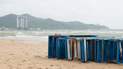 Old sunbeds on sandy seashore. Stock Footage 294665917