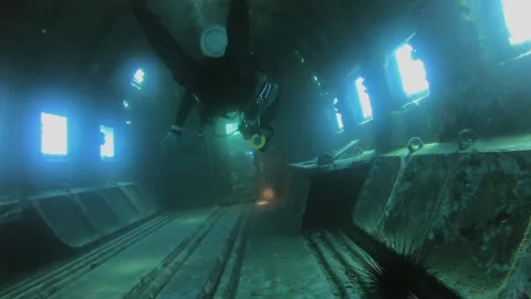 Old sunken war plane wreck underwater resting on deep sea floor - Exploration Stock Footage 340637777