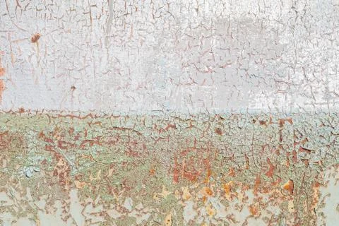 Old surface of the metal sheet covered with old paint, texture background Stock Photos