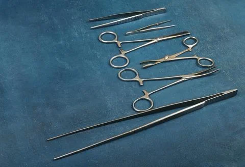 Old surgical instruments, shallow depth of sharpness, grunge background Stock Photos