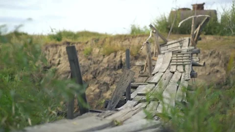 Old suspension bridge over the river in the forest Stock Footage 80279006