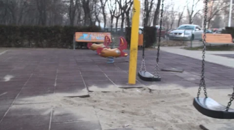 Old Swing In A Deserted Park Pan-Shot Stock Footage 34295292