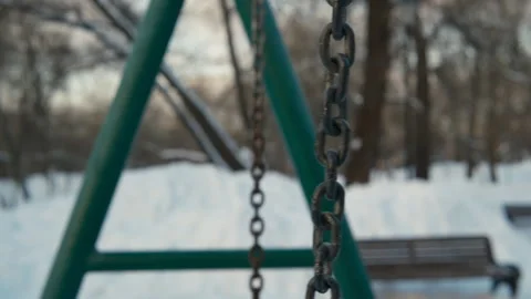 Old swing on rope playground winter gloomy day Video stock 265272817