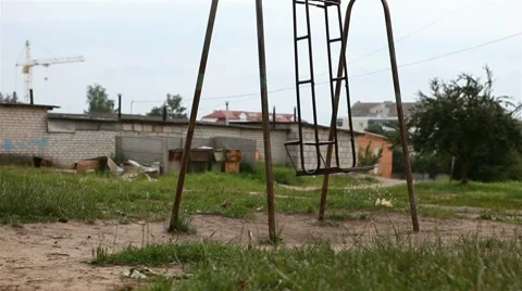 Old swing swaying in the wind Stock Footage 8558264